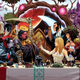 The cover of Immortal X-Men #1, drawn by Mark Brooks and featuring the comic's cast of mutants sitting at a dinner table.